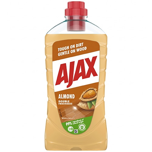 Sticlă cu soluție de curățat pentru lemn Ajax Almond, cu lichid de culoare galben-auriu, capac roșu și etichetă ce ilustrează o migdală pe o pardoseală din lemn.